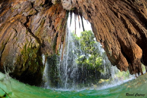 Behind the water curtains by Raoul Caprez 
